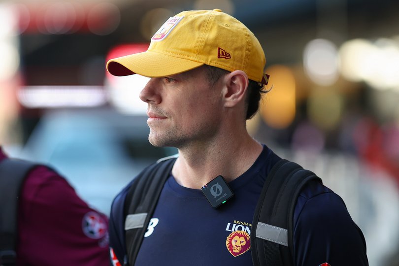 Lachie Neale of the Lions arrives at Melbourne Airport.