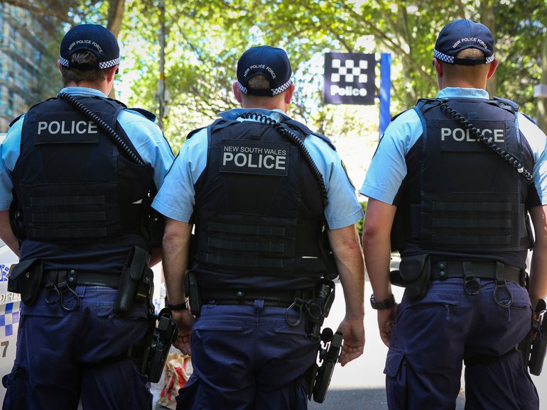 Two police officers were in the vehicle at the time of the incident.