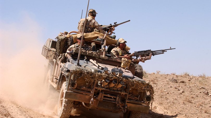 Australian Army soldiers from Special Operations Task Group patrol in surveillance reconnaissance vehicles outside the perimeter of a forward operating base in Afghanistan.