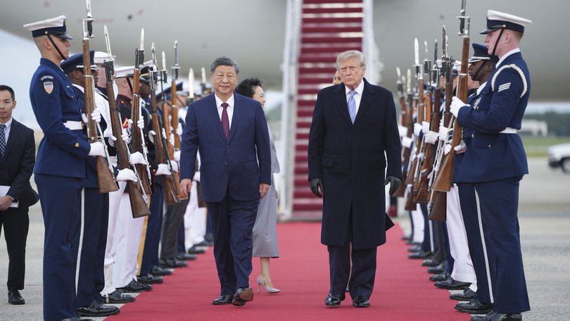 President Xi Jinping of China and President Donald Trump walk a red carpet after Xi’s arrival at Joint Base Andrews in Maryland.