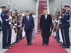 President Xi Jinping of China and President Donald Trump walk a red carpet after Xi’s arrival at Joint Base Andrews in Maryland.