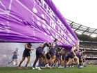 Fremantle players run out before the AFL Grand Final.