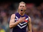Hayden Young of the Dockers celebrates a goal.