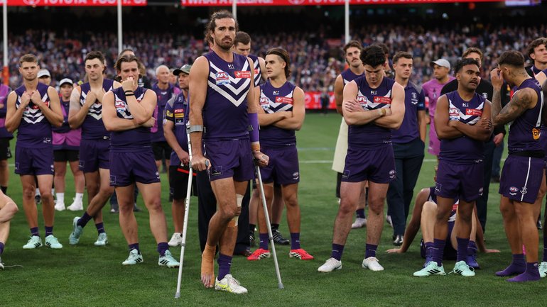 Dockers players look on after their defeat.