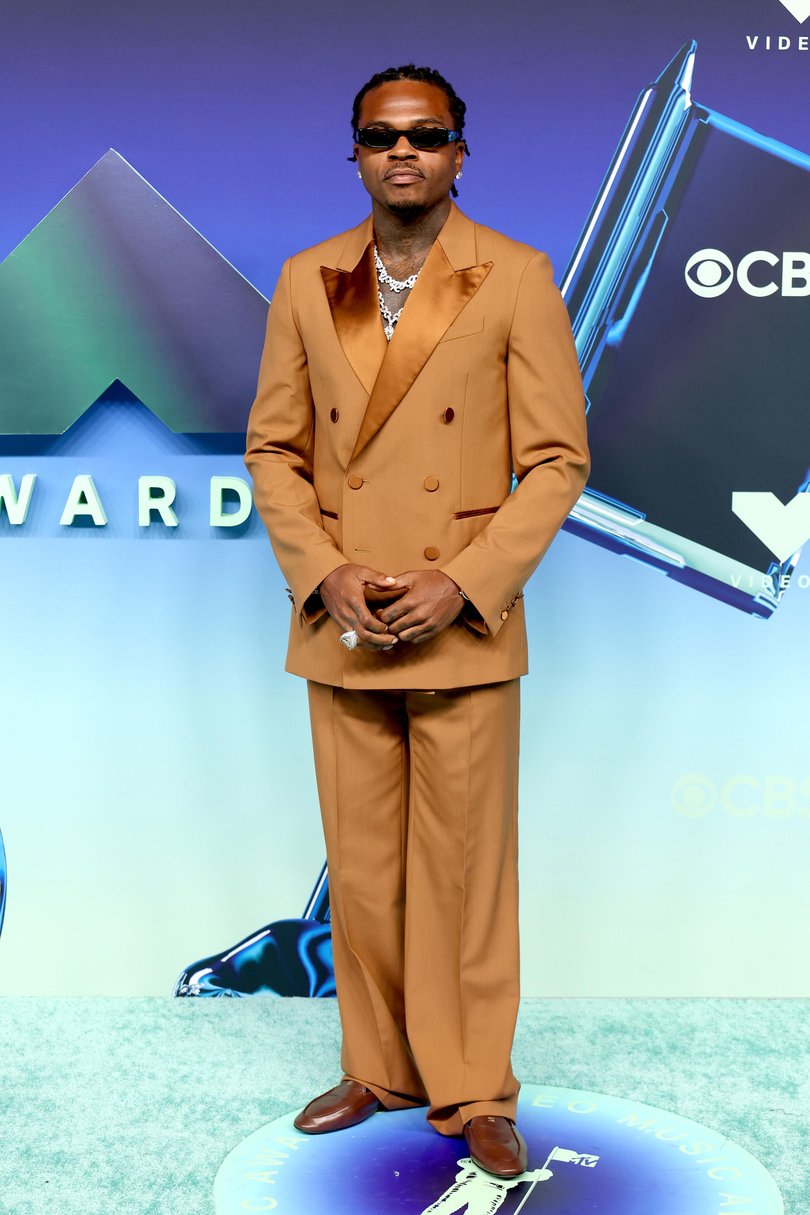 American rapper Gunna looked suave in an elegant burnt orange suit.