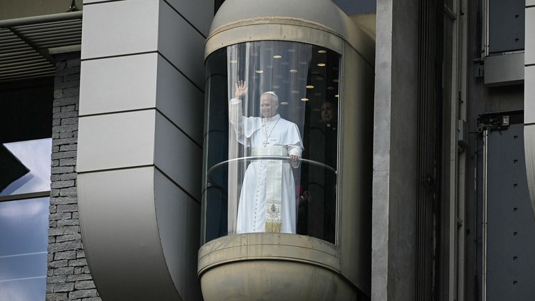 The Pope takes an elevator during his visit in Lourdes southwestern France.