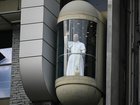 The Pope takes an elevator during his visit in Lourdes southwestern France.