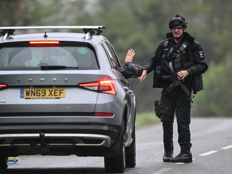 A police roadblock  outside RAF Fairford base in Fairford, south-west England.