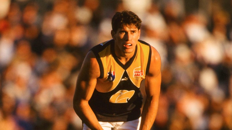 Laurie Bellotti of the Eagles looks to pass during the 1999 round 13 AFL match between the Geelong Cats and the West Coast Eagles at Shell Stadium. GSP Images