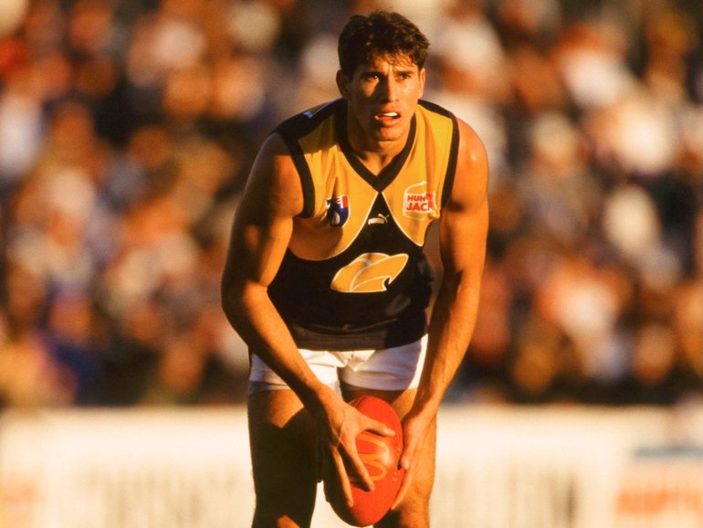 Laurie Bellotti of the Eagles looks to pass during the 1999 round 13 AFL match between the Geelong Cats and the West Coast Eagles at Shell Stadium. GSP Images