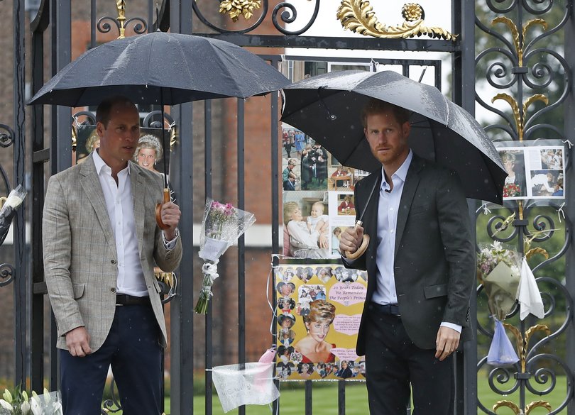 William and Harry amongst the floral and pictorial tributes to Diana on the 20th anniversary of her death in 2017.