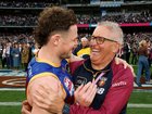 Chris Fagan embraces Lachie Neale.