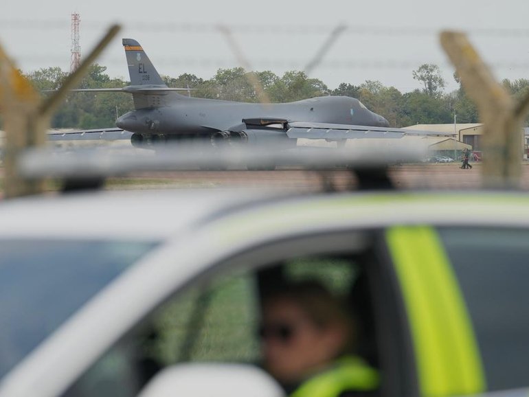 UK police say a quantity of petrol but no explosive devices were found in three vans that sparked a major security alert near an air base used by the US.