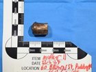 A photo of a bullet recovered from underneath the floor of Mr Baird’s kitchen. court exhibit