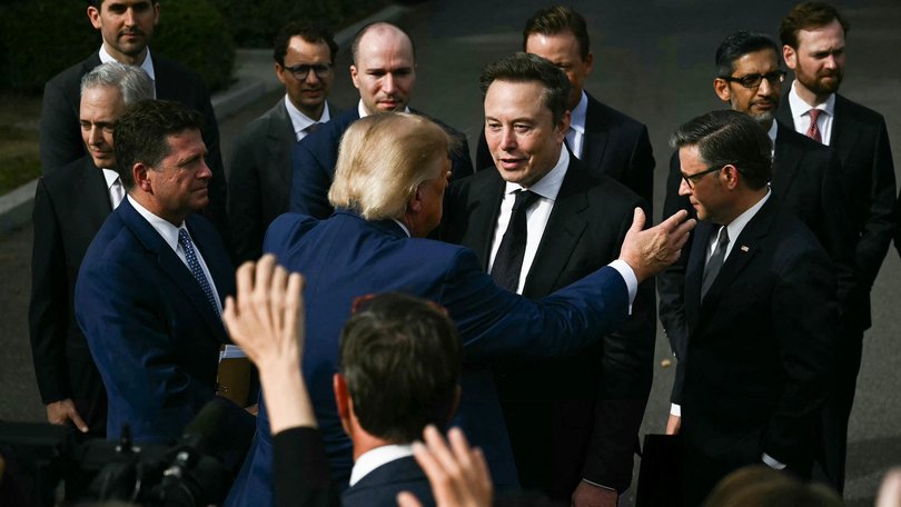 Donald Trump greets Elon Musk.