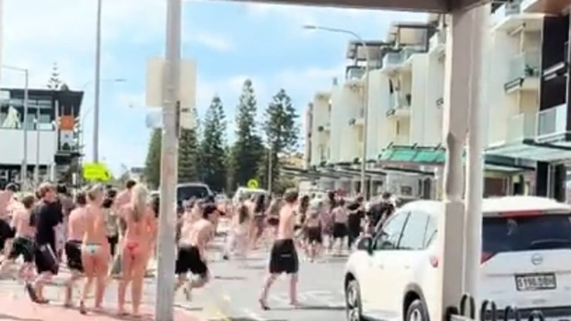 A witness said a boy had been pushed to the ground and was being punched and kicked while swarms of teenagers ran to watch. Picture: TikTok