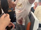 A bloodied Flydubai passenger on board the plane at the centre of the reported hijacking attempt.