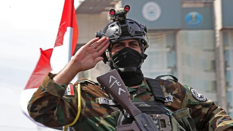 Iraqi troops have paraded in vehicles through Baghdad streets to mark the withdrawal of US forces. (EPA PHOTO)