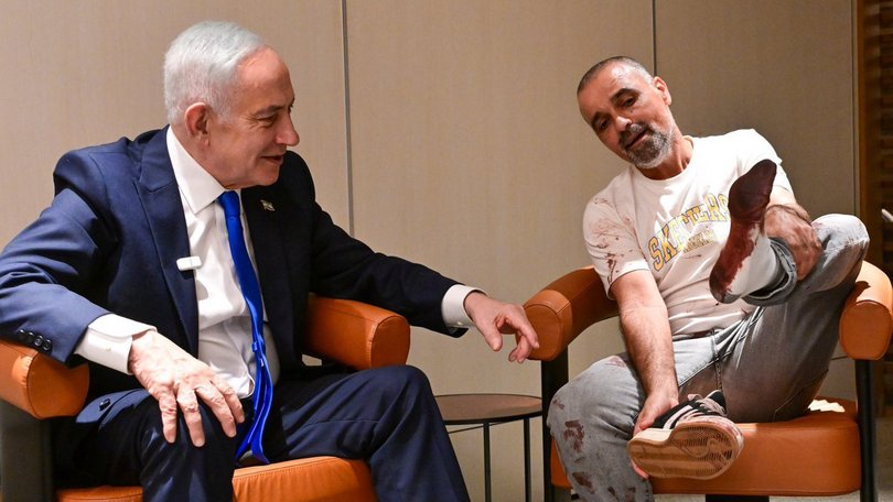 Prime Minister Benjamin Netanyahu at his Ben-Gurion International Airport meeting with Yaniv Hayun, the passenger who broke into the cockpit on the flight from Dubai to Israel.