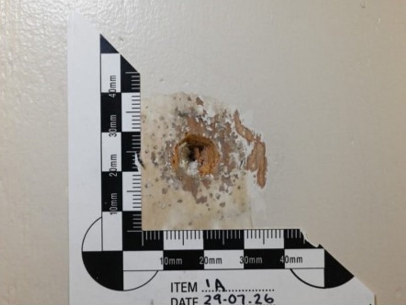 A bullet hole was only discovered on Mr Baird’s door this year as it had been covered with a hook. Picture: Court exhibit.