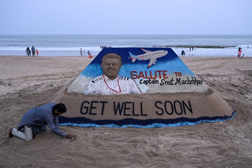 A sculpture made by India's sand artist Sudarsan Pattnaik depicts India's pilot Smit Machchhar, the captain of flydubai flight FZ 1073, at a beach in Odisha's Puri city.