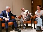 Prime Minister Benjamin Netanyahu at his Ben-Gurion International Airport meeting with Yaniv Hayun, the passenger who broke into the cockpit on the flight from Dubai to Israel.