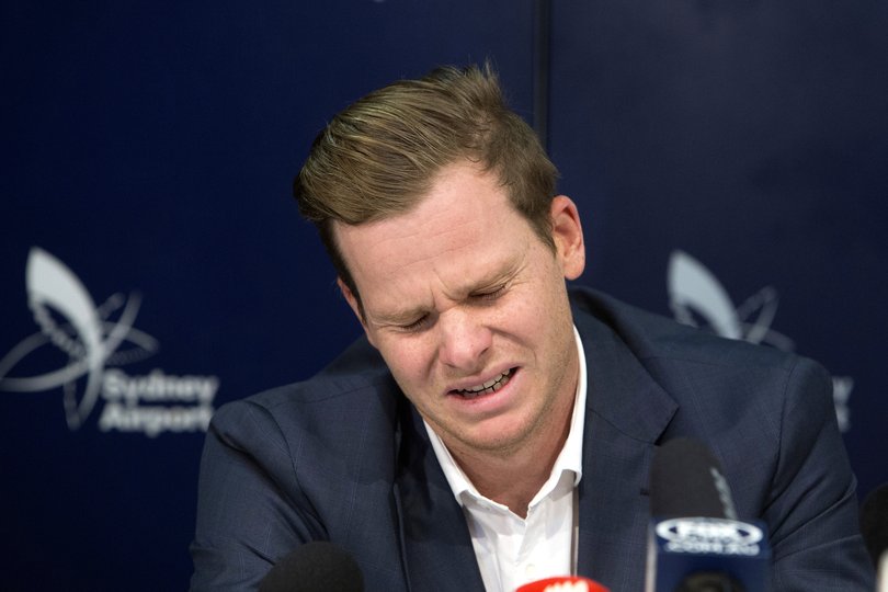 Former Australian cricket captain Steve Smith grimaces as he speaks to the media in Sydney, Thursday, March 29, 2018, after being sent home from South Africa following a ball tampering scandal. Smith and vice-captain David Warner were banned for 12 months while young batsman Cameron Bancroft received 9 months after an investigation into the Australian cricket team's cheating scandal identified Warner as the instigator of the ball tampering plan that unraveled in South Africa. (AP Photo/Steve Christo)