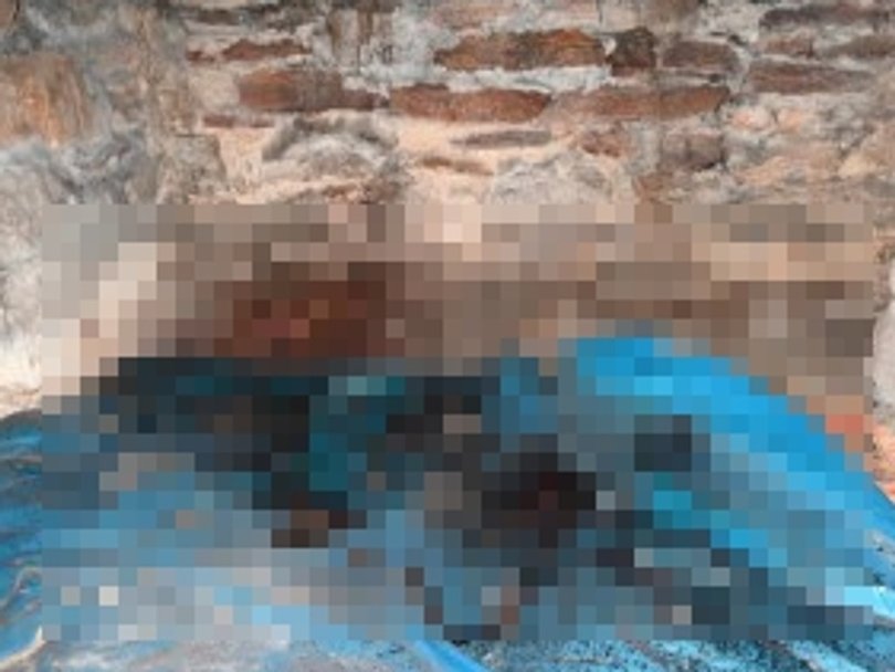 A crime scene photo from blood pooled on a tarp beneath the floor of Mr Baird’s room. Picture: Court exhibit.