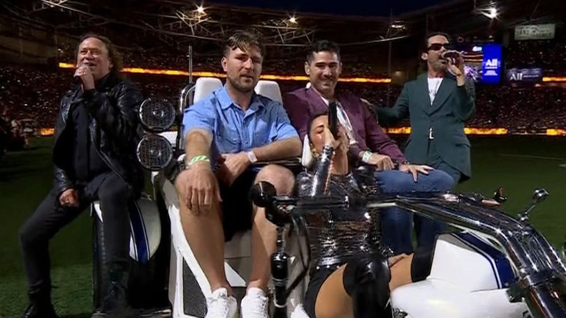 The pre-match show finished with the trio surrounding the vehicle.