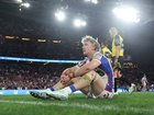Fletcher Sharpe of the Knights looks dejected after a loss following the NRL Grand Final match between the Sydney Roosters and Newcastle Knights.