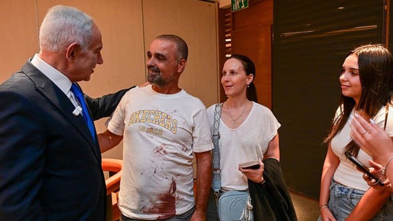 Israeli Prime Minister Benjamin Netanyahu meets with Yaniv Hayun, one of the passengers who averted the hijacking of the Flydubai jet.