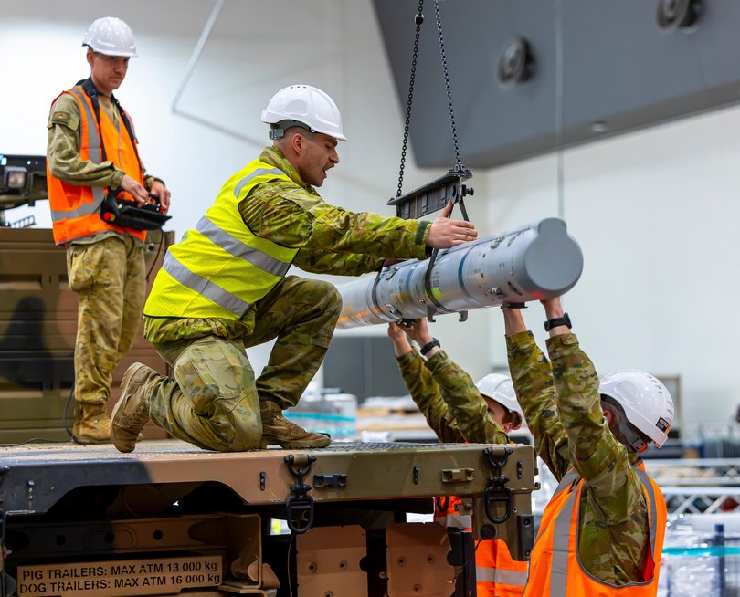 Australian Army soldiers from 16 Regiment, Royal Australian Artillery mount missiles for the National Advanced Surface to Air Missile System (NASAMS).