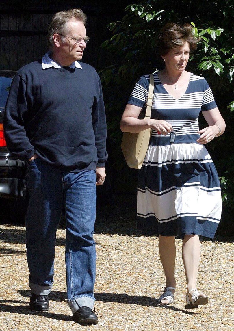 Author and disgraced politician Jeffrey Archer and his wife Mary Archer arrive at their home in Grantchester, England, Sunday July 13, 2003. Archer was on a home visit from prison before his expected release on Monday July 21, 2003 after serving two years of his  four year sentence on charges of perjury. 
