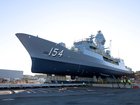 HMAS Parramatta is moved towards the lift during the Ships undocking at the BAE Systems shipyard in Henderson, Western Australia.