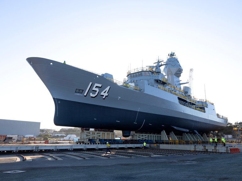 HMAS Parramatta is moved towards the lift during the Ships undocking at the BAE Systems shipyard in Henderson, Western Australia.