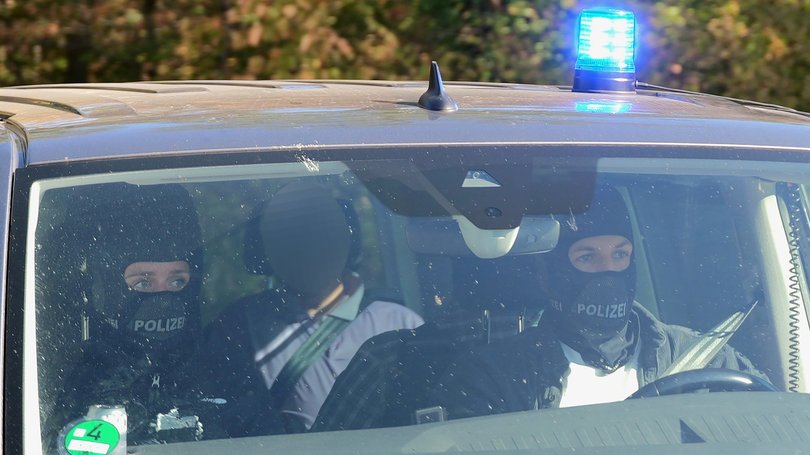Manfred D., former office manager for former BND President Hanning, is being taken to the Federal Court of Justice in Karlsruhe following his arrest. 