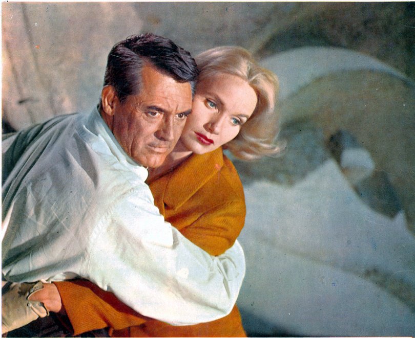 Cary Grant holding Eva Marie Saint in a scene from the film 'North By Northwest', 1959.