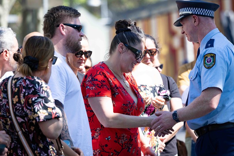 Constable Mia Lay’s mother Tamara Lay (red shirt) and partner Daniel Vasquez (white shirt).