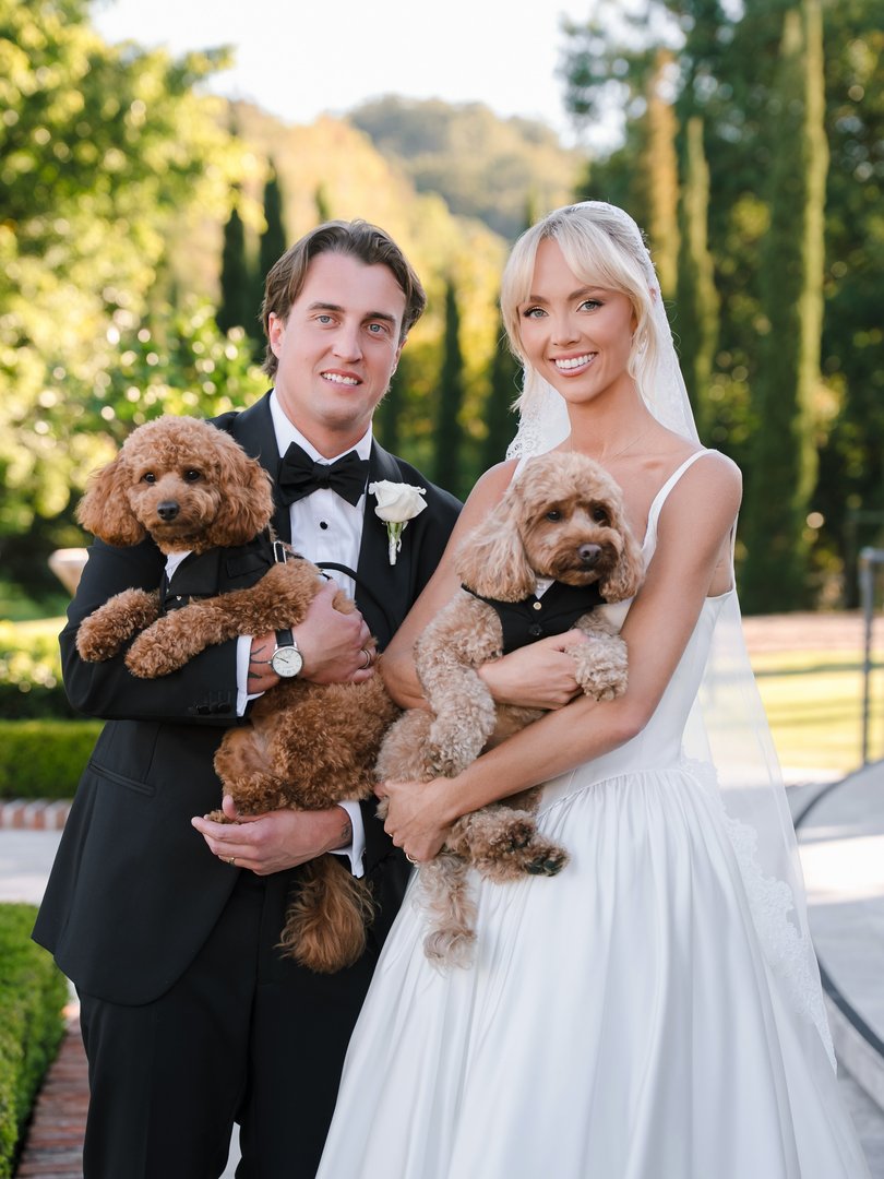 Henry Brayshaw and Annie Knight with their dogs at their wedding.