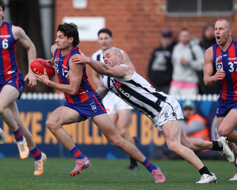 Dominic Bedendo of the Borough is tackled by Tom Mitchell of the Magpies.
