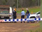 Police and forensic officers examine the scene where a man was found dead on Wednesday morning.