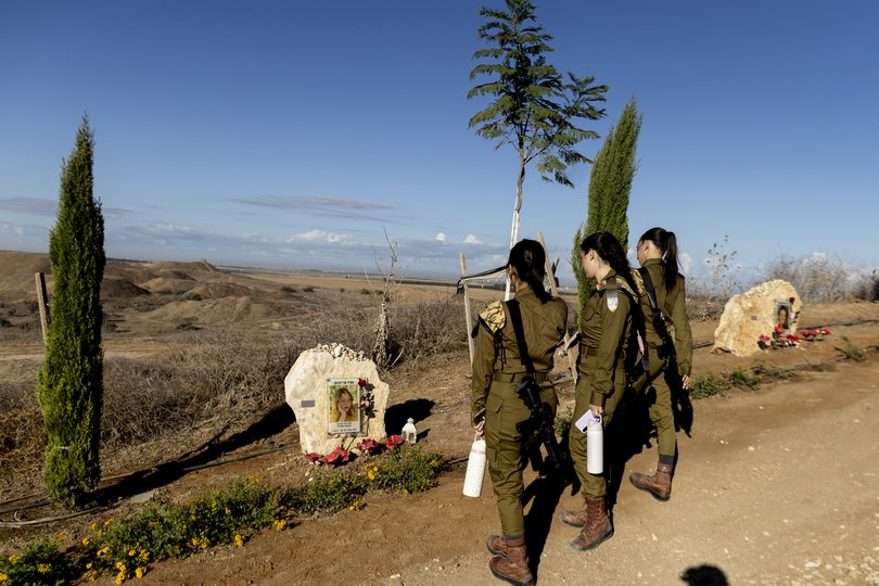 Israeli soldiers pay a tribute for a female observer unit soldier that was killed during the Oct. 7 assault on Nahal Oz base as Israel marks the third anniversary of the 2023 attacks.