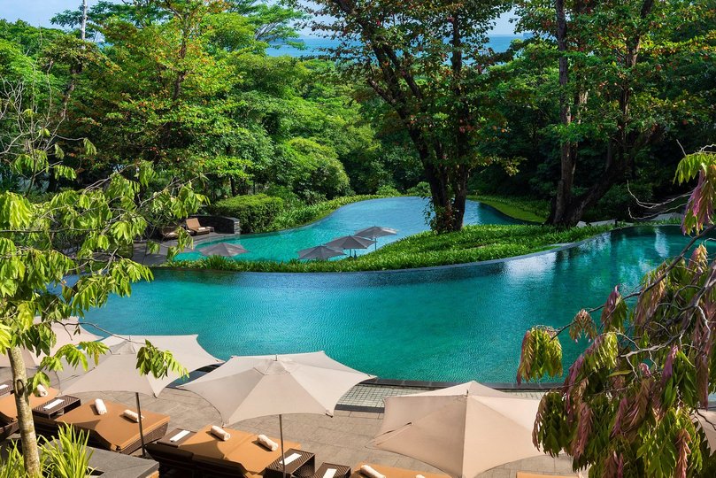 Capella’s main tiered and cascading pool, set against lushly dense tropical foliage and a soundtrack of cicadas.