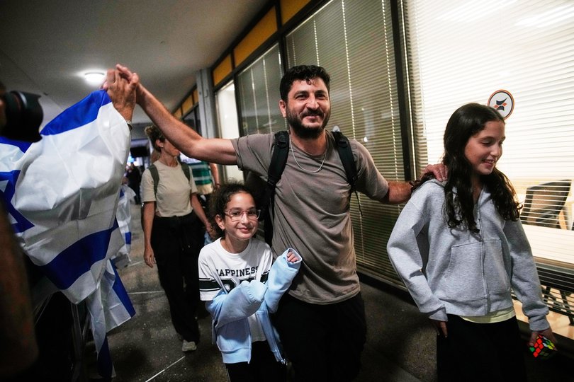 Israeli passengers who had been aboard a flydubai aircraft that made an emergency landing in Saudi Arabia are welcomed at the arrivals gate at Ben Gurion International Airport near Tel Aviv, Israel.