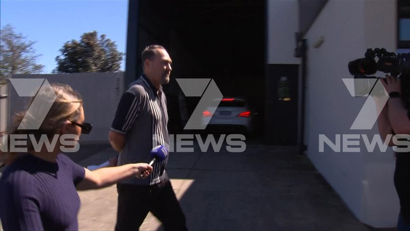 James Vlassakis seen walking through the Adelaide Pre-release Centre car park before getting into a white car.