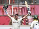 Matthew Renshaw of Australia celebrates his 100 runs.