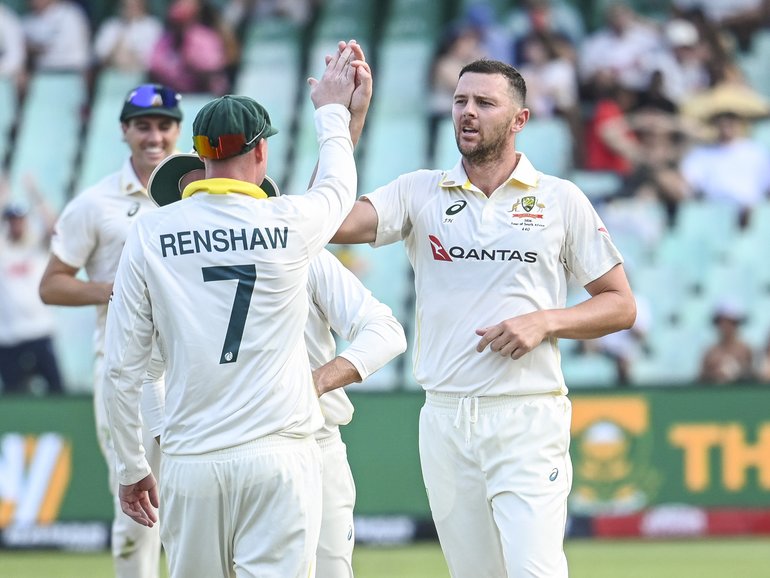 Josh Hazlewood of Australia celebrates the wicket of Ryan Rickelton.