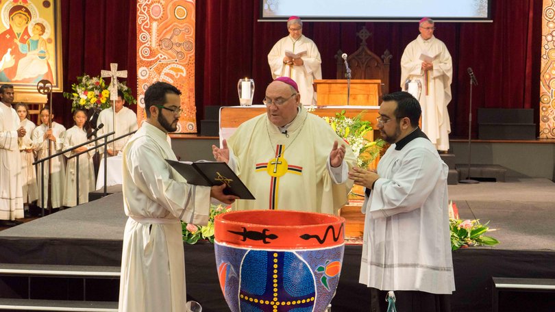 Bishop of Broome Christopher Saunders (centre) before his conviction. 