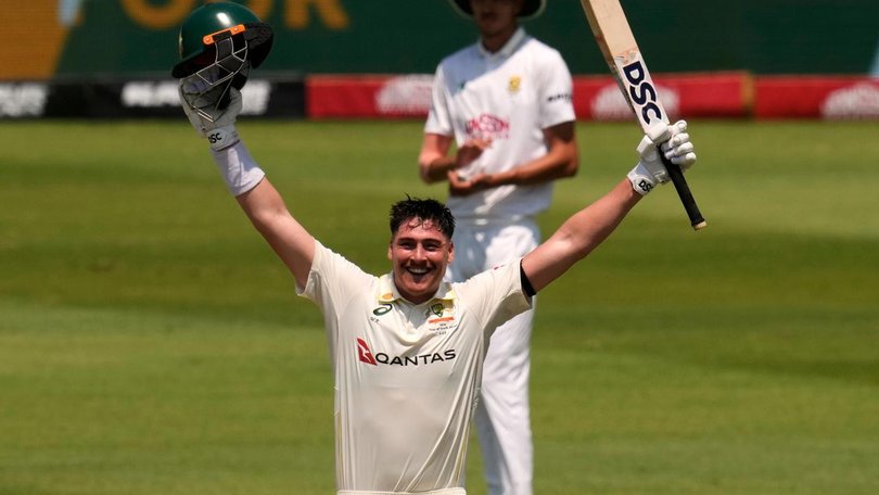 Australia's Matt Renshaw raises his arms in triumph after reaching his second Test century. 