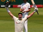 Australia's Matt Renshaw raises his arms in triumph after reaching his second Test century. 